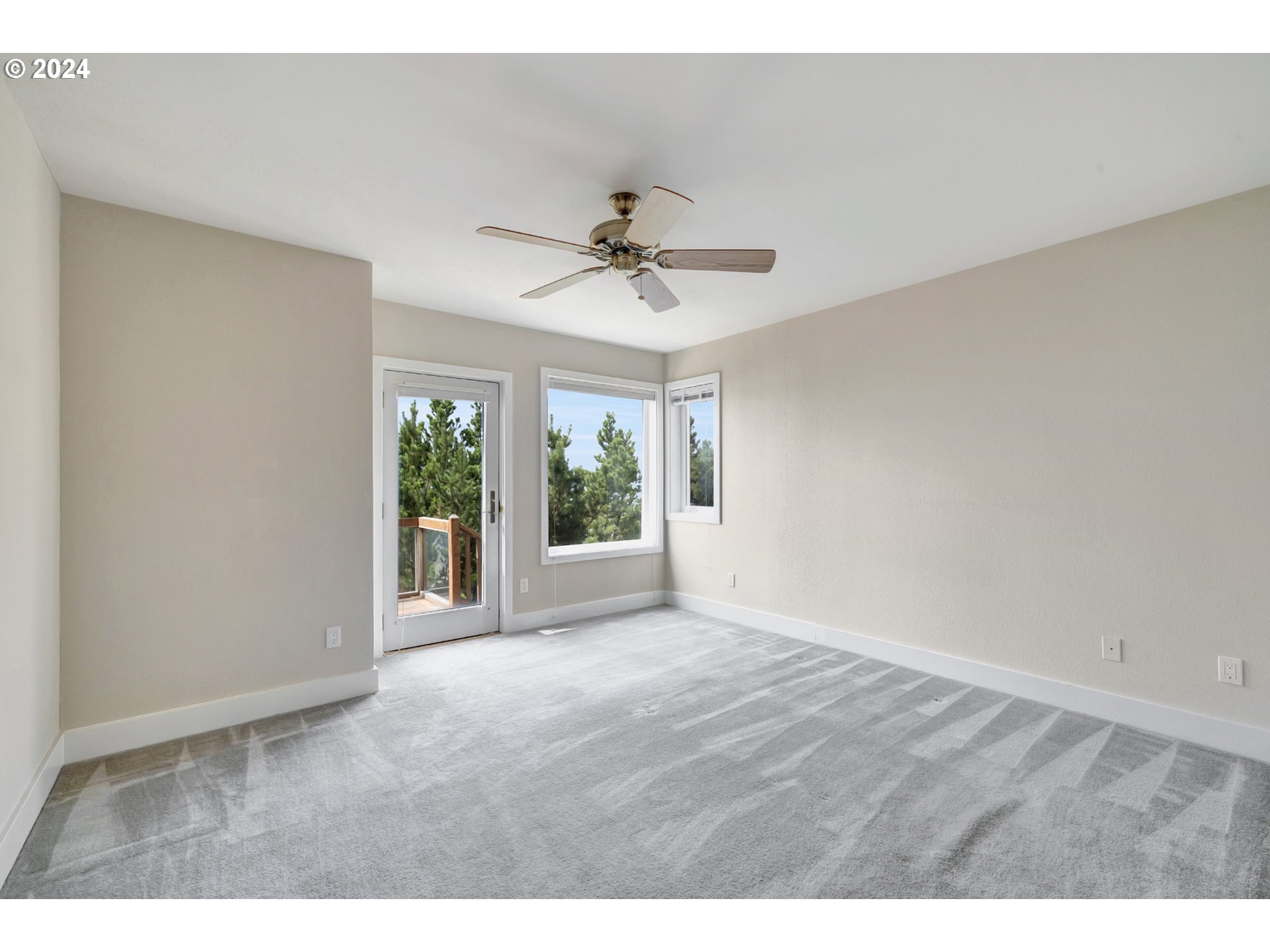 130 Capes Drive Oceanside, OR 97141 - Photo 38 of 48 a view of an empty room with a window