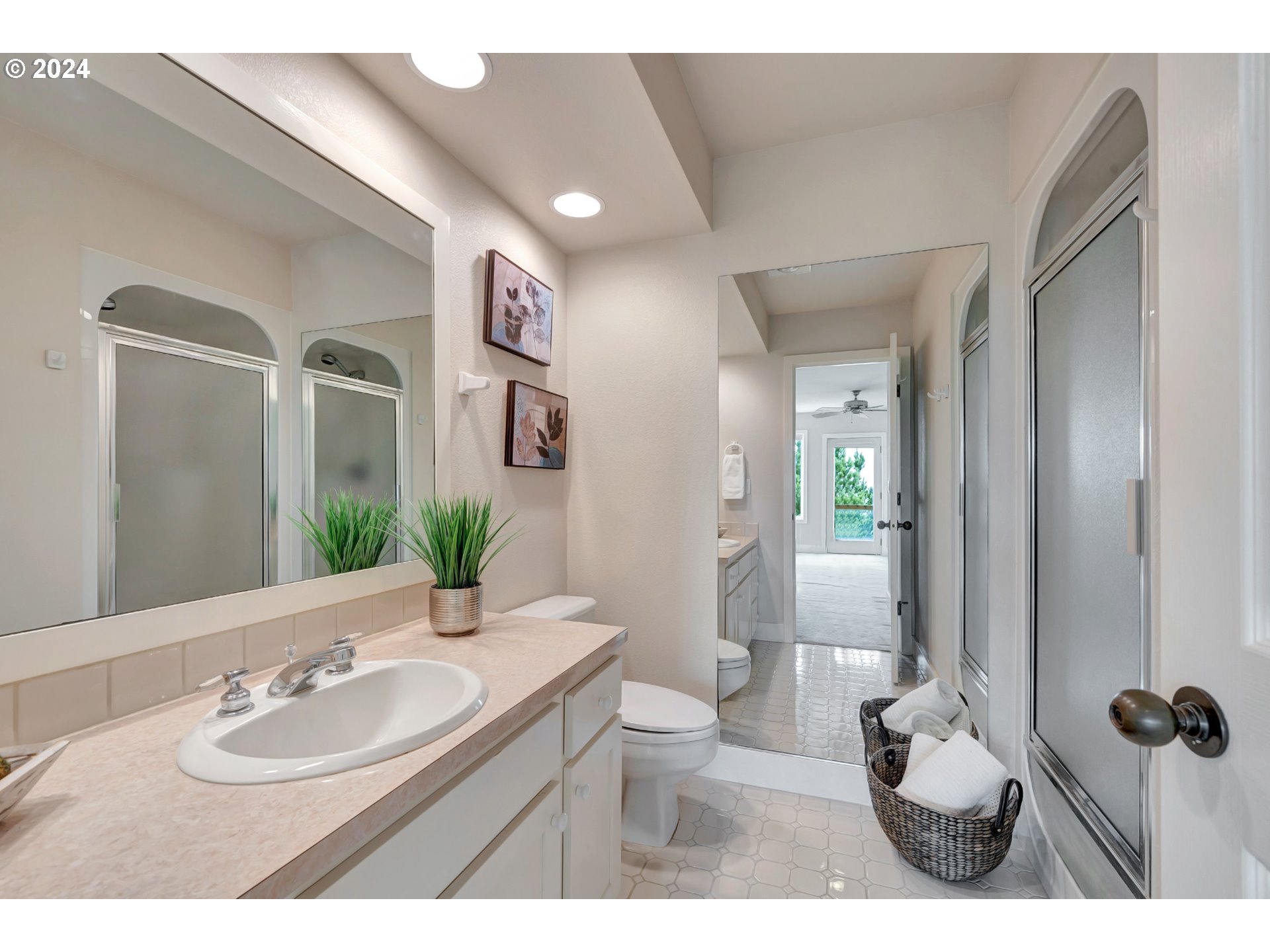 130 Capes Drive Oceanside, OR 97141 - Photo 41 of 48 a bathroom with a granite countertop sink a toilet and mirror
