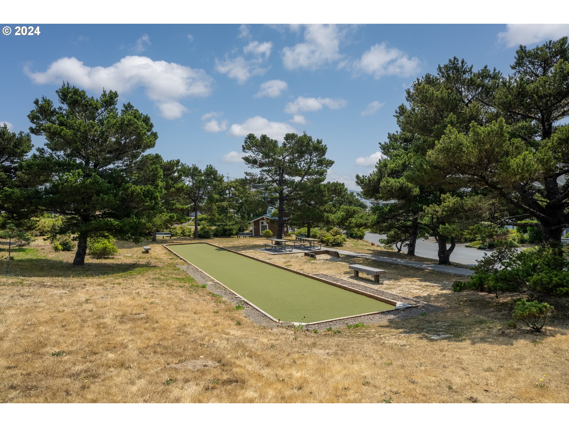 130 Capes Drive Oceanside, OR 97141 - Photo 42 of 48 a view of a swimming pool with a yard