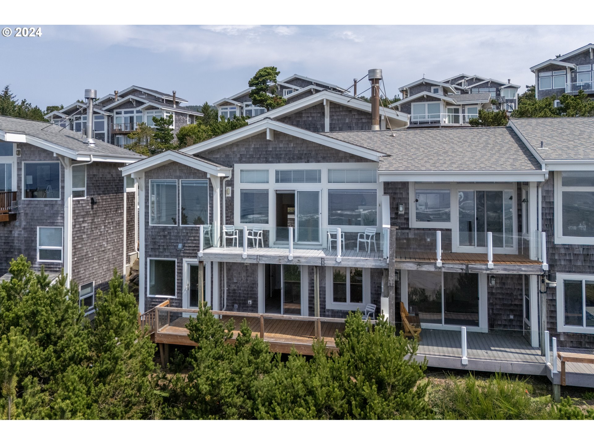 130 Capes Drive Oceanside, OR 97141 - Photo 7 of 48 a view of a big yard in front of a building