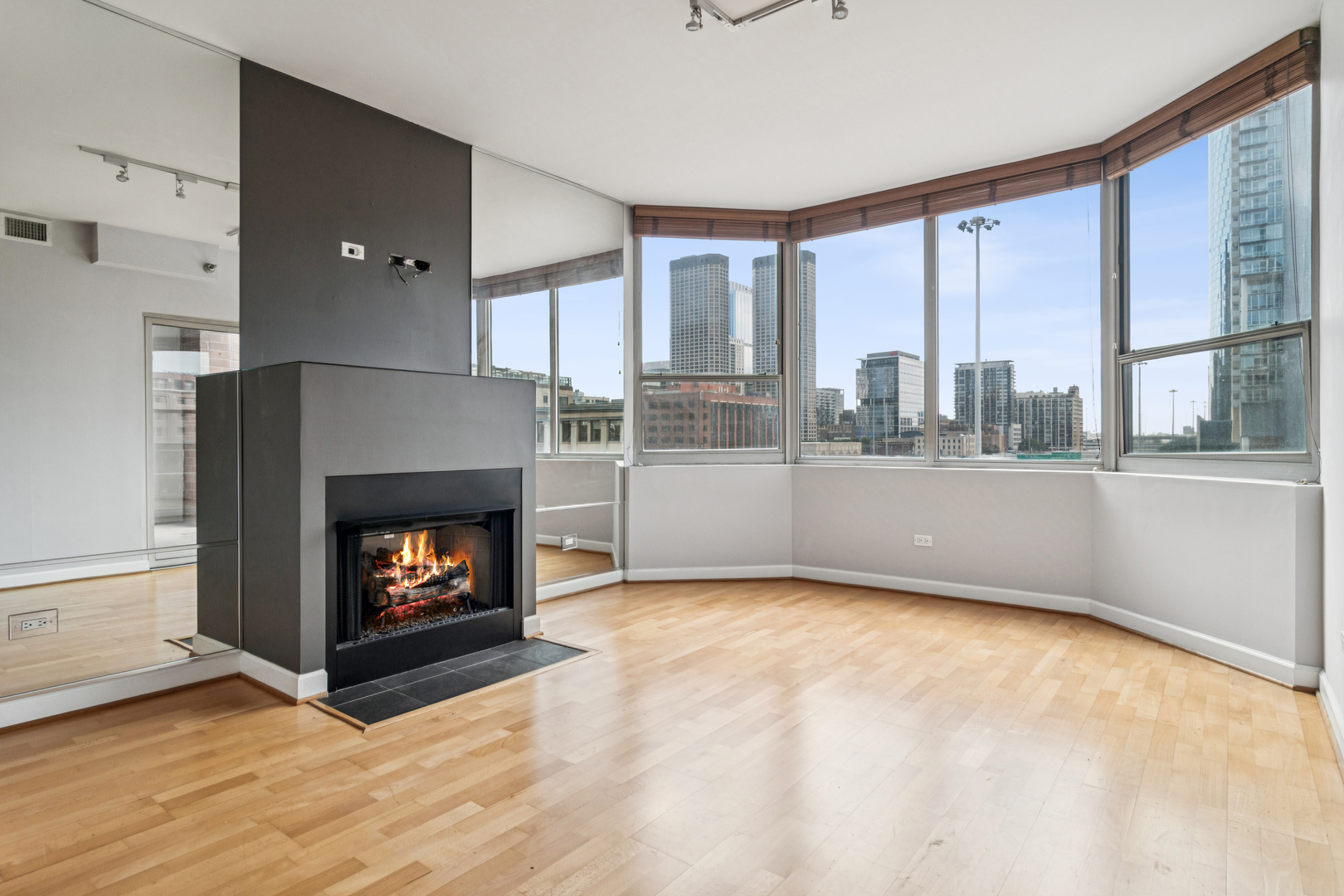 720 West Randolph Street, Unit 502 Chicago, IL 60661 - Photo 2 of 22 a living room with furniture and a fireplace
