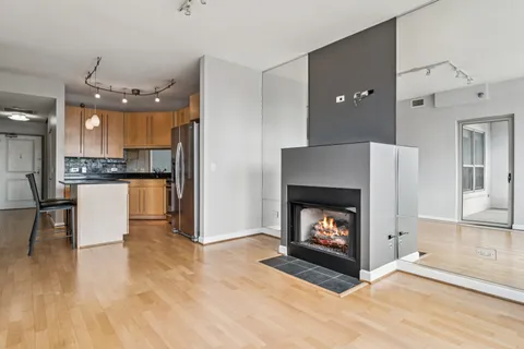 a view of kitchen with furniture and fireplace
