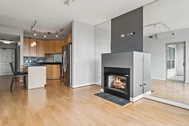 a view of kitchen with furniture and fireplace