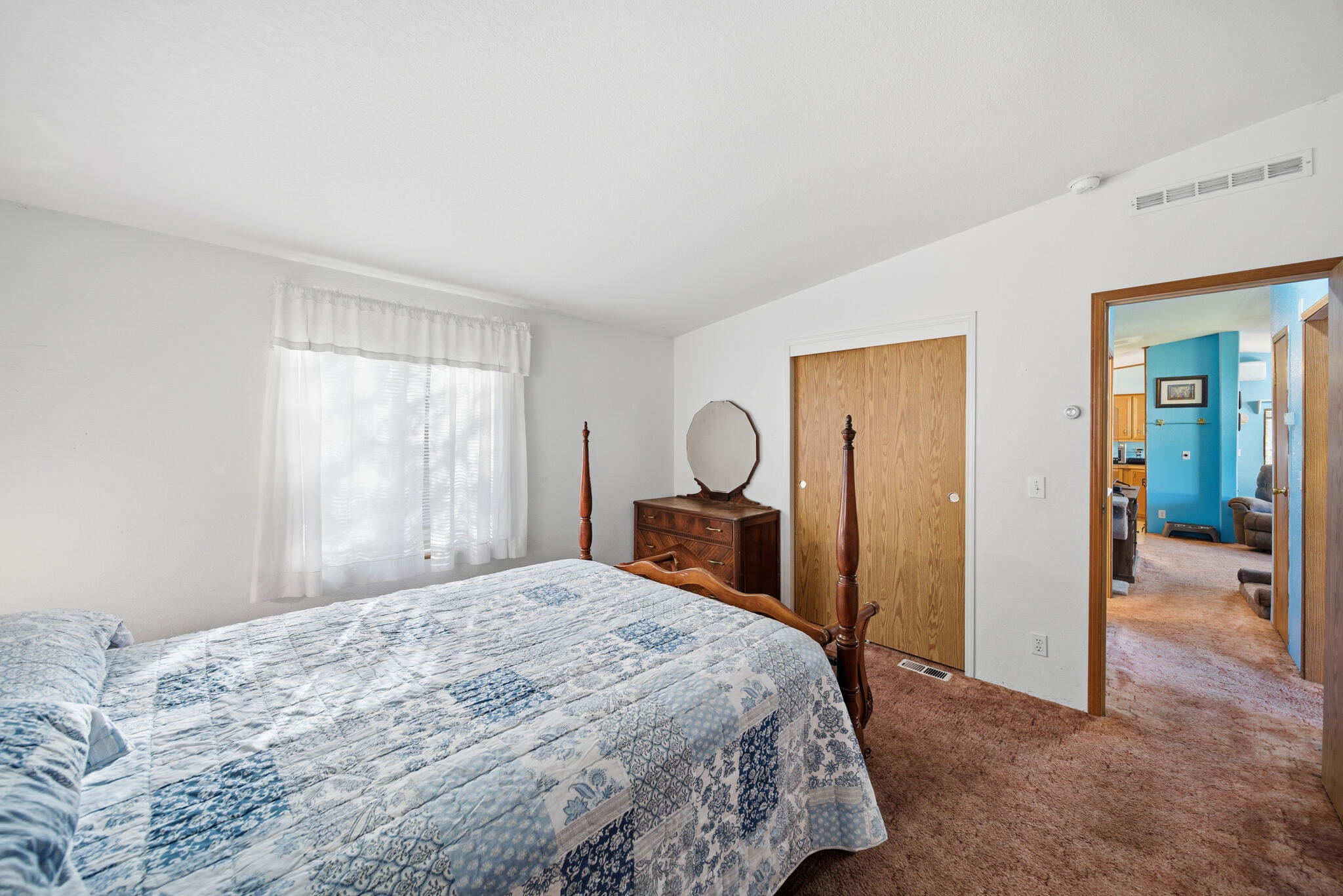 Undisclosed Address Redding, CA 96003 - Photo 11 of 39 a bedroom with a bed and a dresser