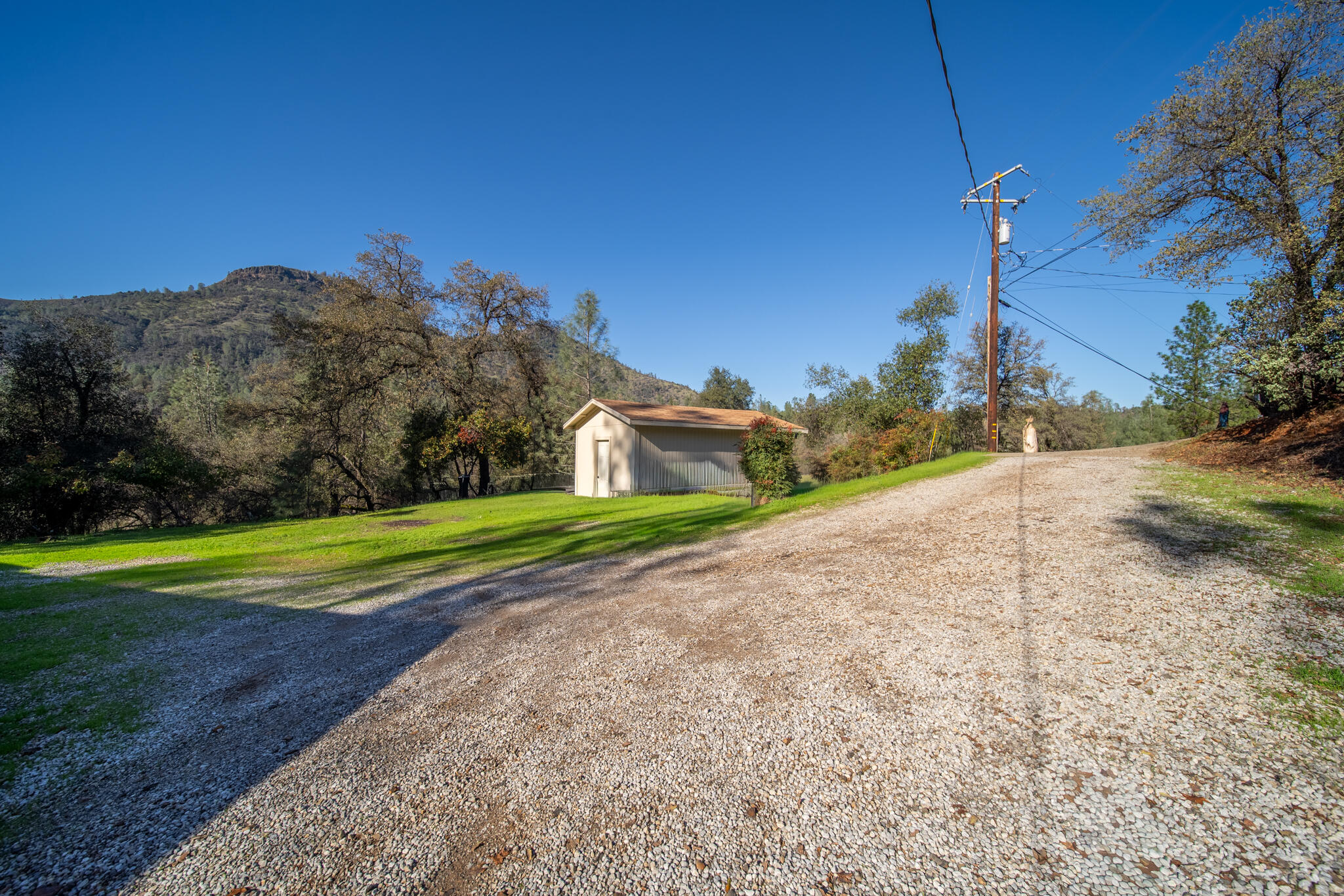 Undisclosed Address Redding, CA 96003 - Photo 17 of 39 a view of a house with a yard