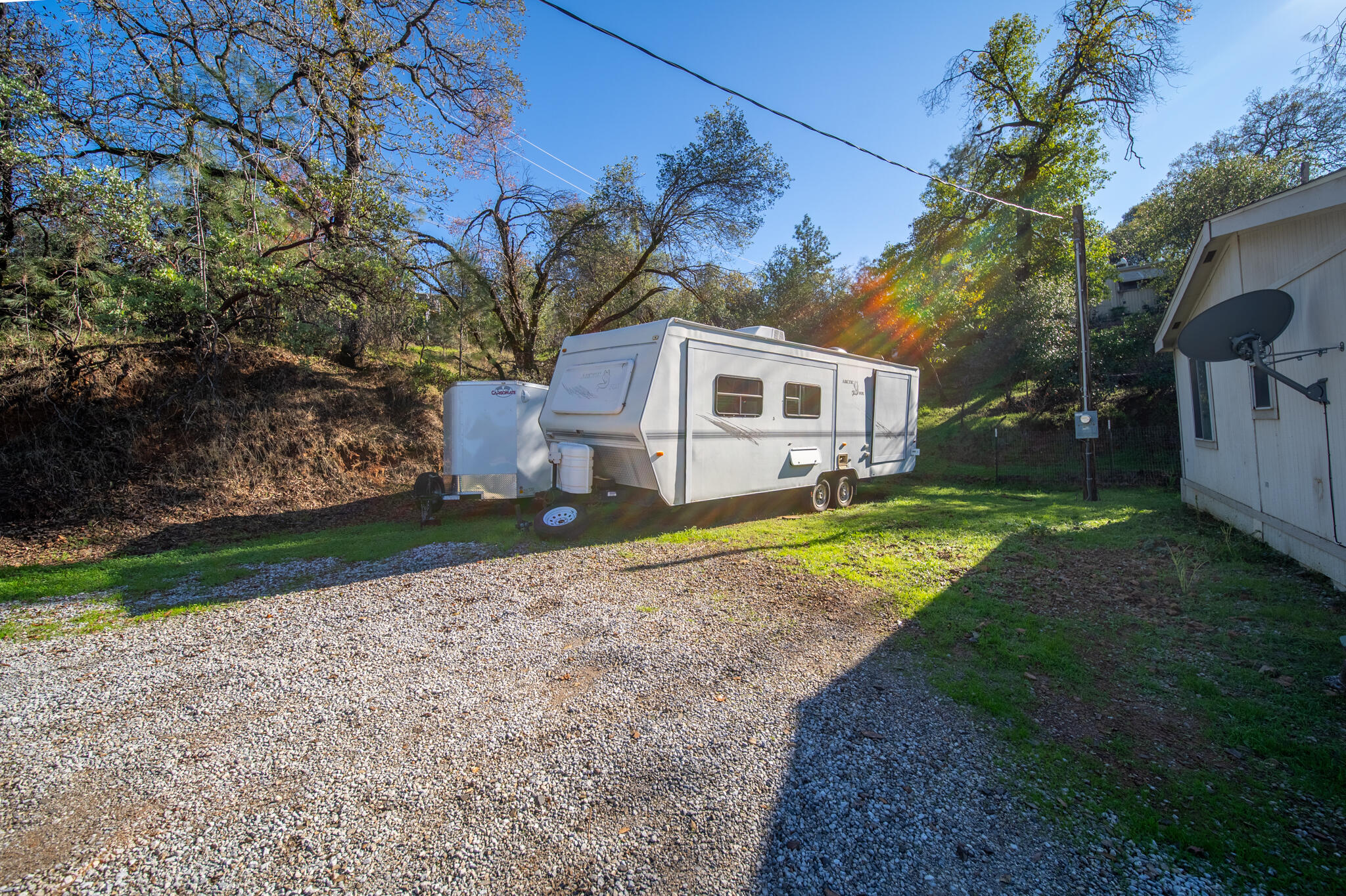 Undisclosed Address Redding, CA 96003 - Photo 19 of 39 a view of a house with a yard