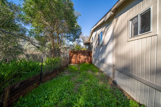 a house view with a backyard space
