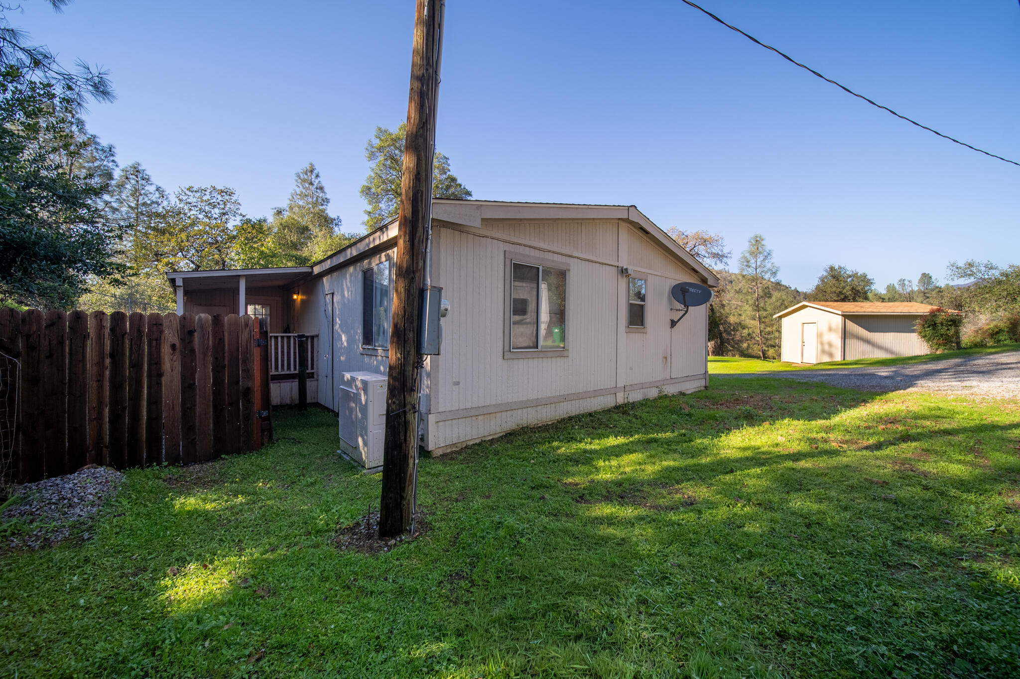 Undisclosed Address Redding, CA 96003 - Photo 24 of 39 a front view of a house with garden