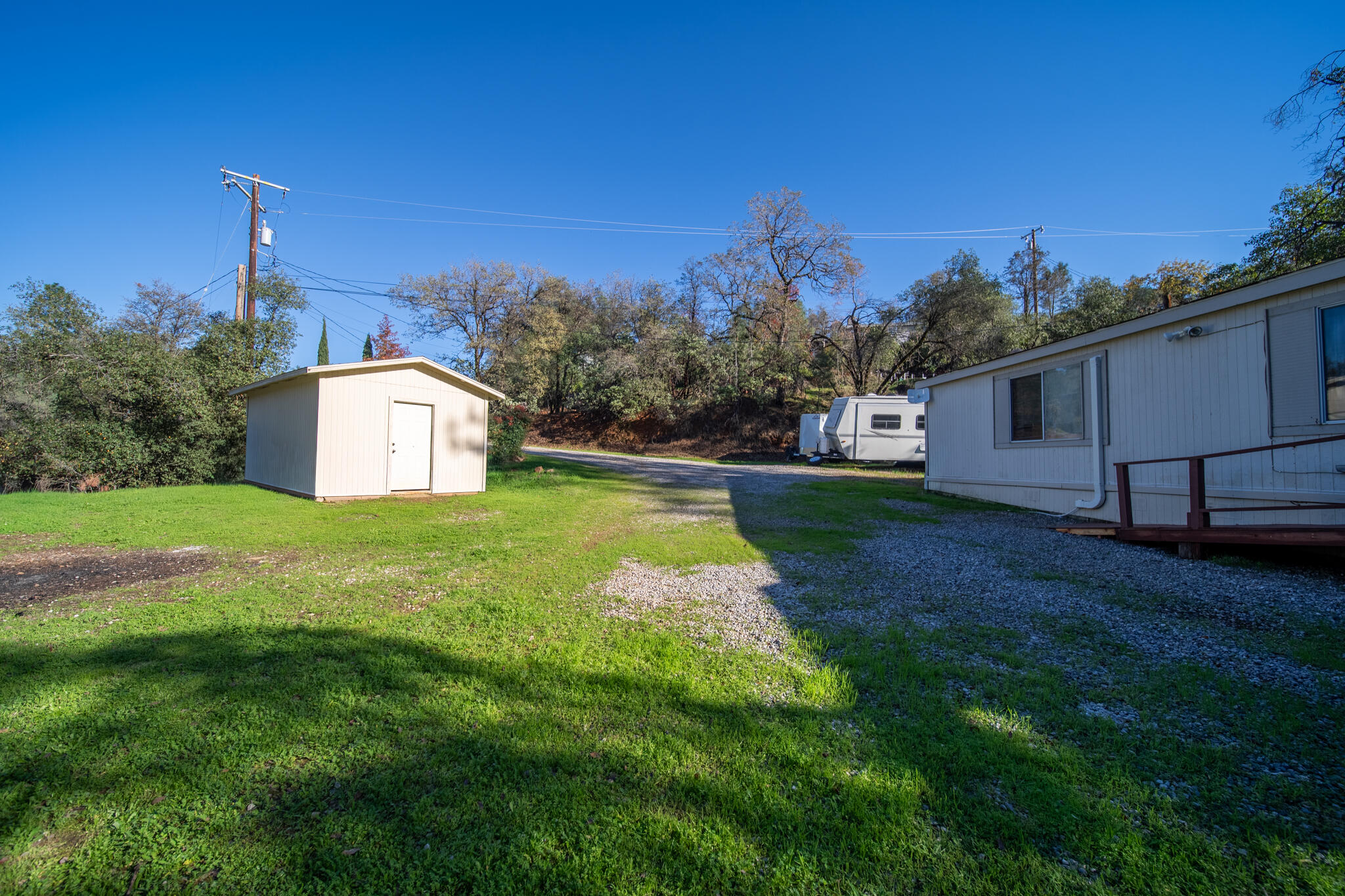 Undisclosed Address Redding, CA 96003 - Photo 26 of 39 a view of a backyard with swimming pool