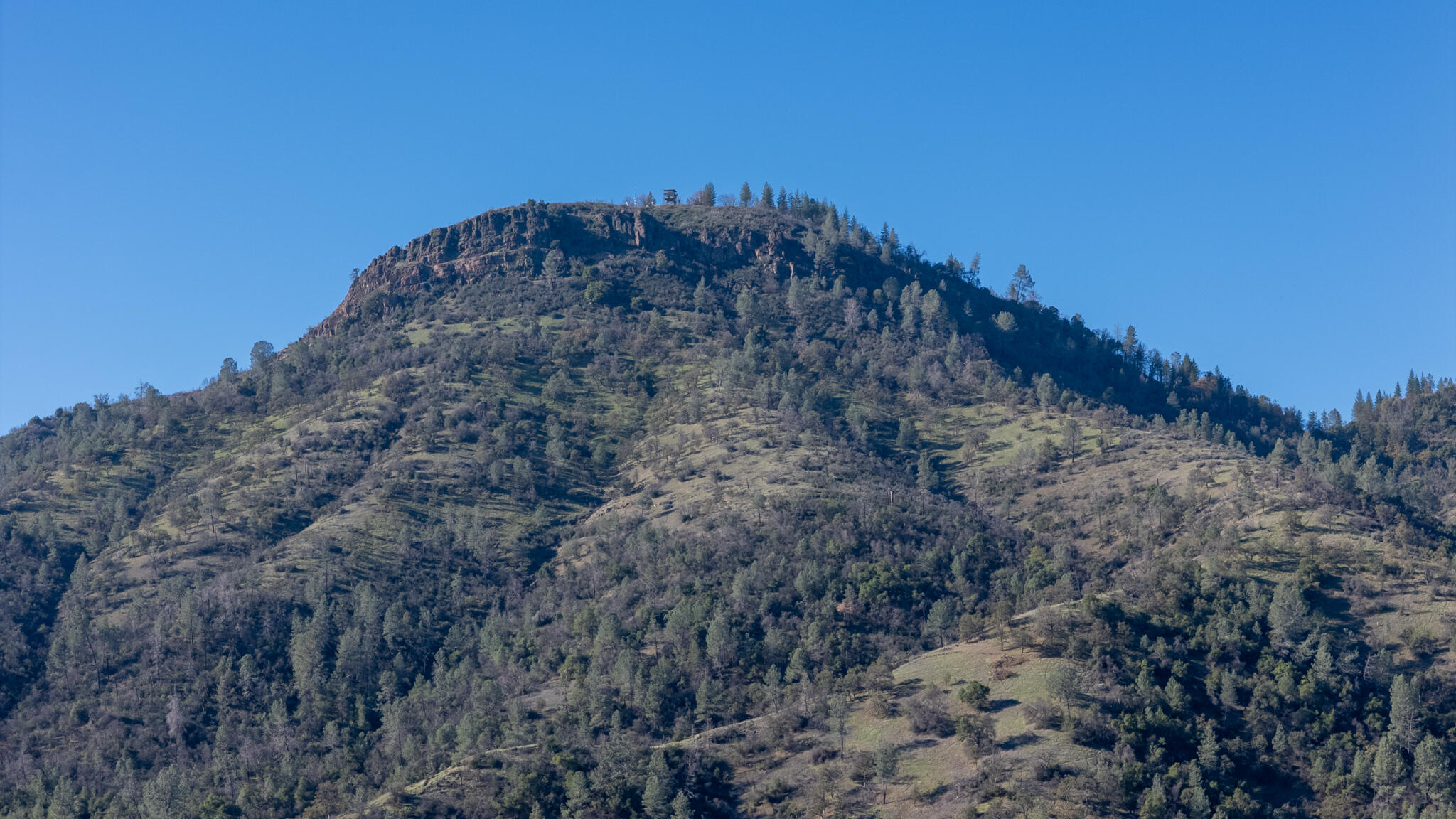 Undisclosed Address Redding, CA 96003 - Photo 36 of 39 a view of a dry yard with mountains in the background