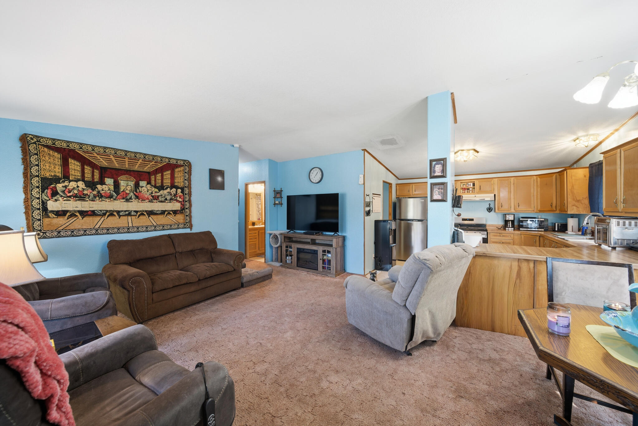 Undisclosed Address Redding, CA 96003 - Photo 5 of 39 a living room with furniture and a flat screen tv