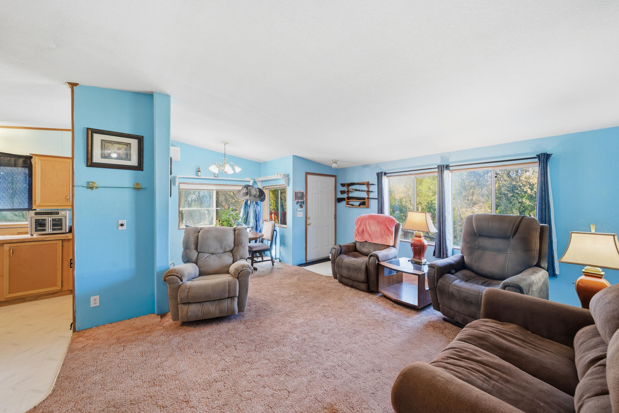 Undisclosed Address Redding, CA 96003 - Photo 6 of 39 a living room with furniture and a large window