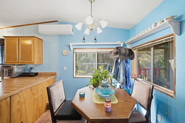 a dining room with furniture and window