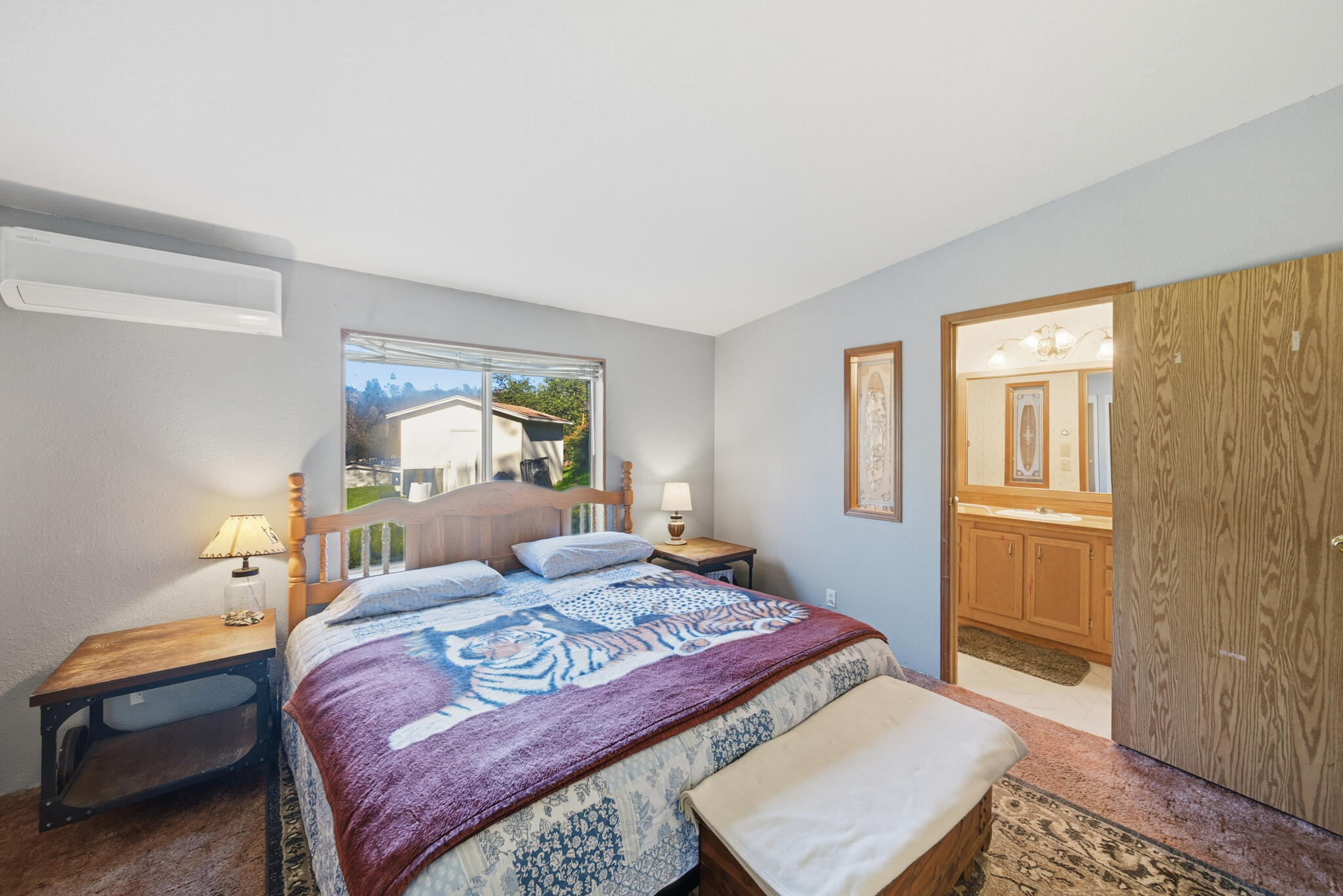 Undisclosed Address Redding, CA 96003 - Photo 8 of 39 a bedroom with a bed and wooden floor