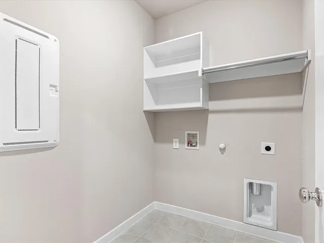 a view of an empty room with a ceiling fan