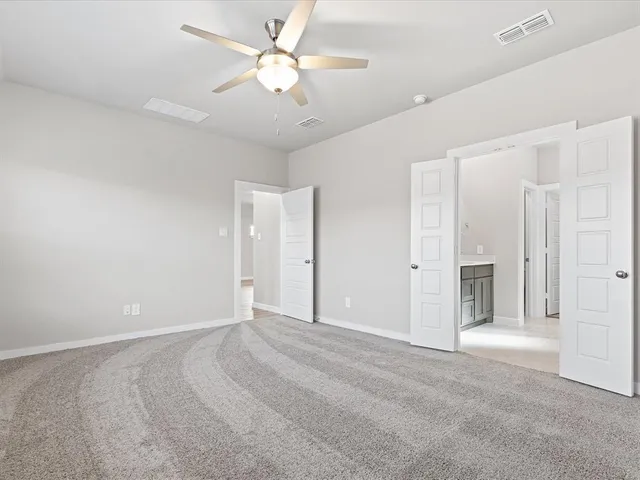 a bathroom with a glass shower door