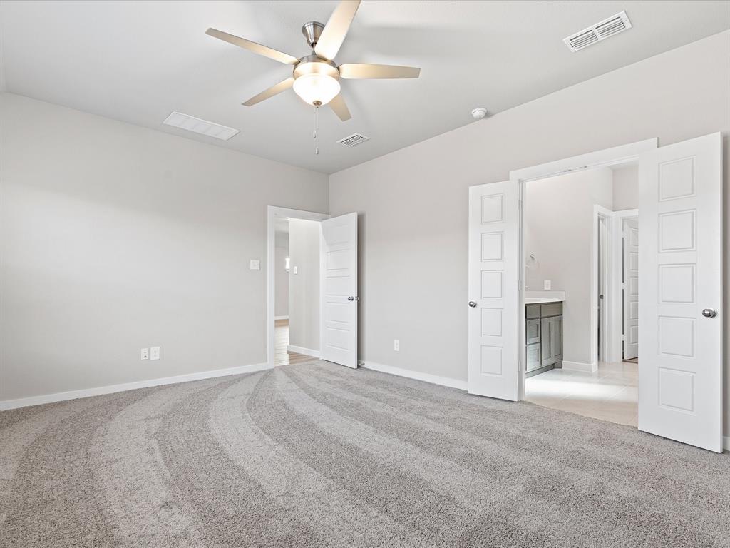 643 Medinah Road Red Oak, TX 75154 - Photo 13 of 28 a view of an empty room with a ceiling fan