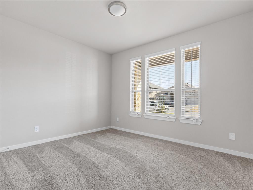 643 Medinah Road Red Oak, TX 75154 - Photo 18 of 28 a view of an empty room with a window