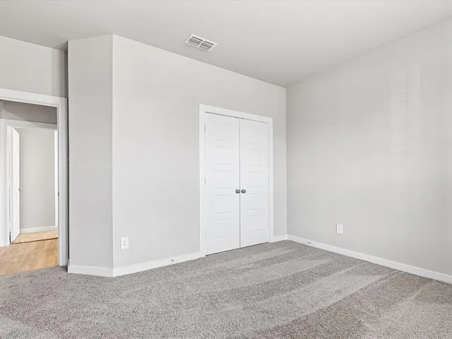 an empty room with an entryway