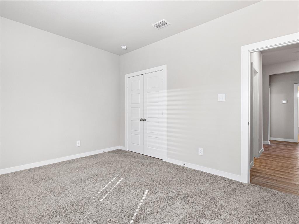 643 Medinah Road Red Oak, TX 75154 - Photo 21 of 28 an empty room with an entryway