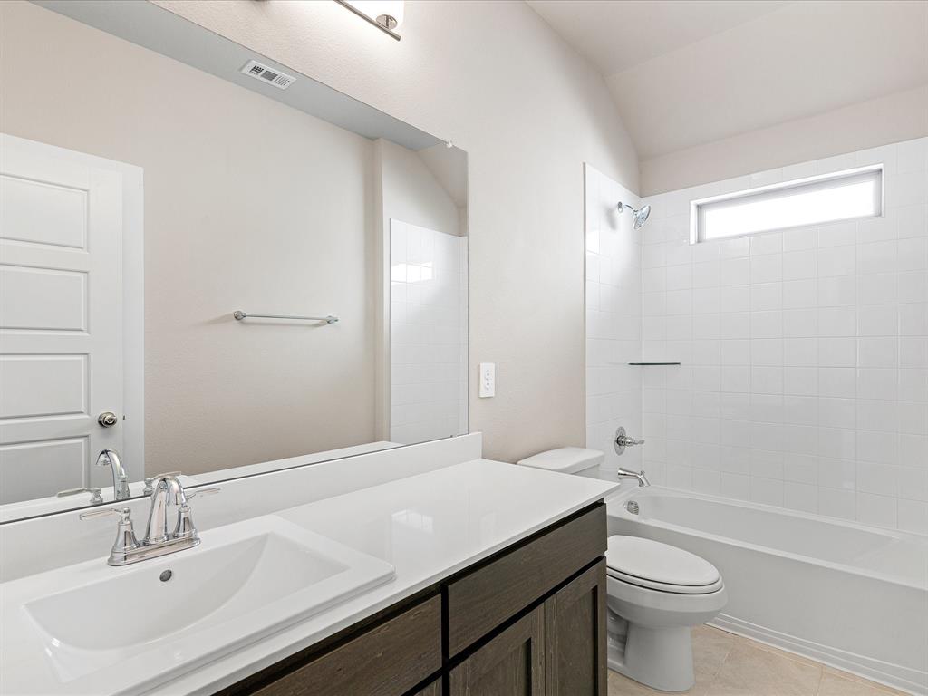 643 Medinah Road Red Oak, TX 75154 - Photo 23 of 28 a bathroom with a sink a toilet and shower