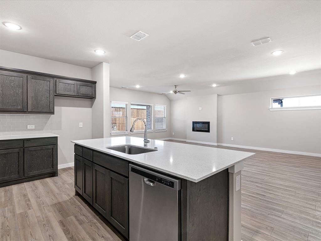 643 Medinah Road Red Oak, TX 75154 - Photo 9 of 28 a kitchen with a sink and cabinets