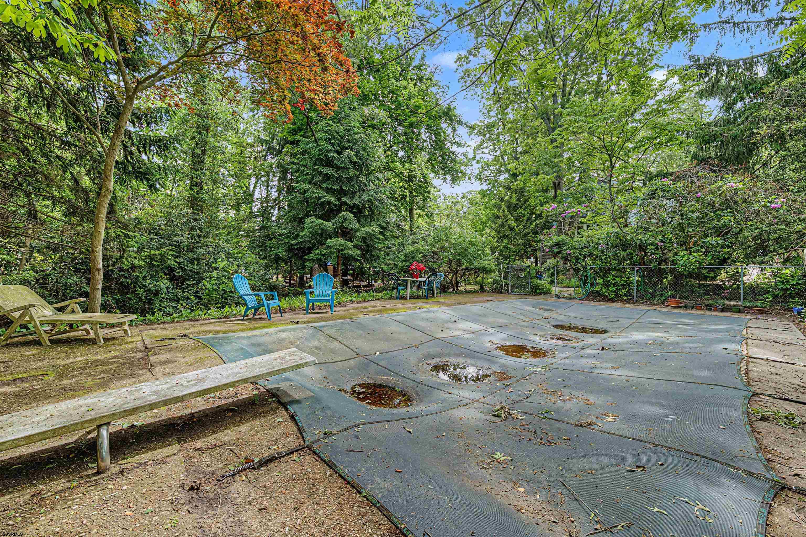 144 Pitney Road Absecon, NJ 08201 - Photo 39 of 47 a view of backyard with a table and chairs