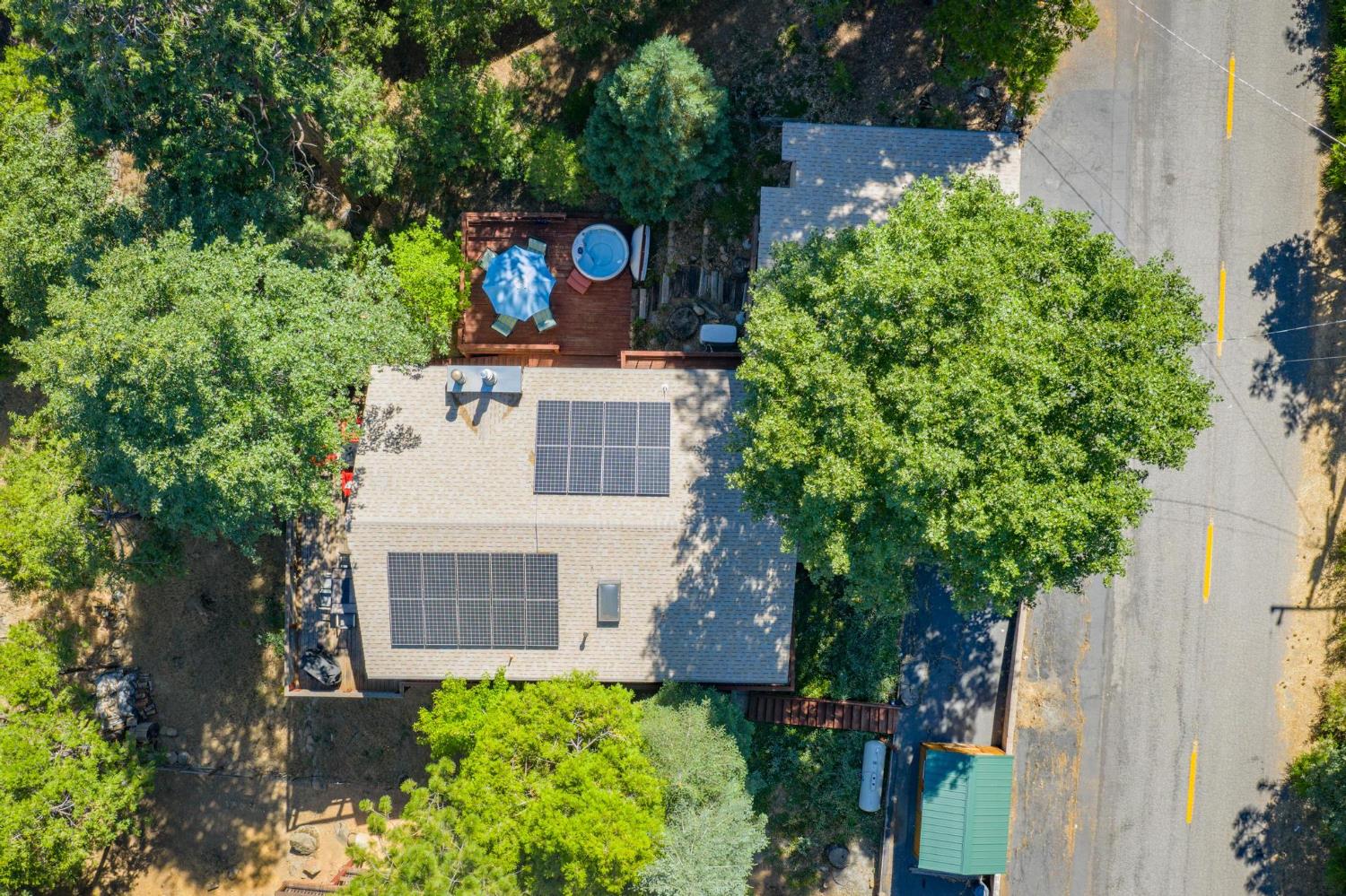 24033 Pine Cone Road Mi Wuk Village, CA 95346 - Photo 2 of 80 front view of a house with a yard