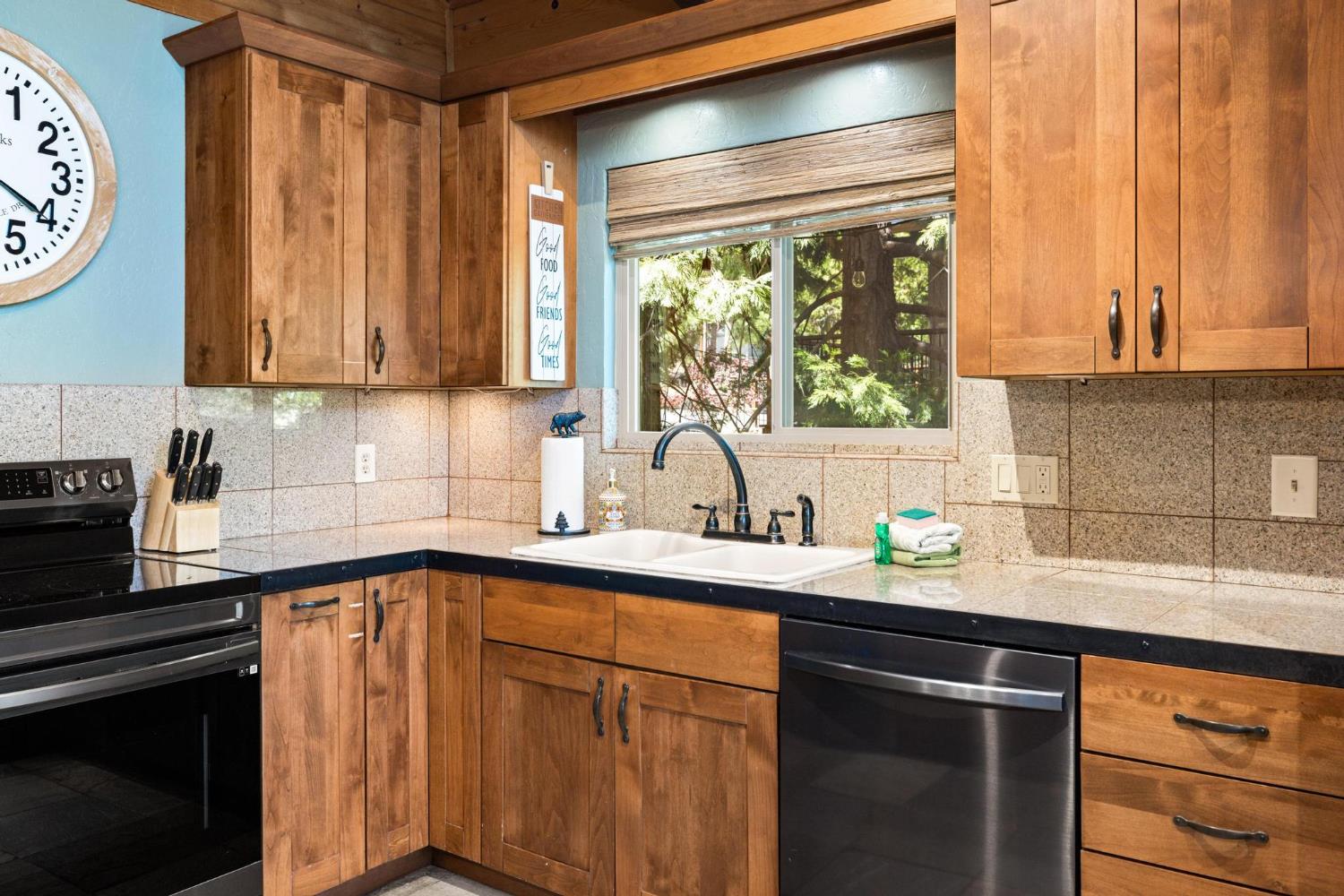 24033 Pine Cone Road Mi Wuk Village, CA 95346 - Photo 21 of 80 a kitchen with a sink cabinets and window