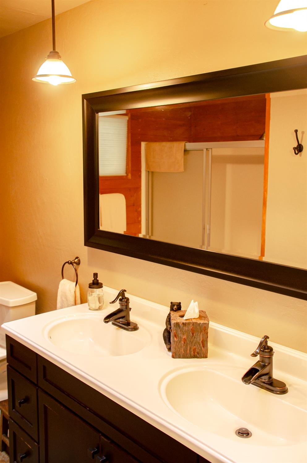 24033 Pine Cone Road Mi Wuk Village, CA 95346 - Photo 35 of 80 a bathroom with a sink and a mirror