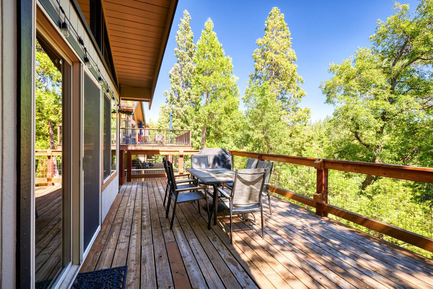 24033 Pine Cone Road Mi Wuk Village, CA 95346 - Photo 47 of 80 a view of a chairs and table in the balcony