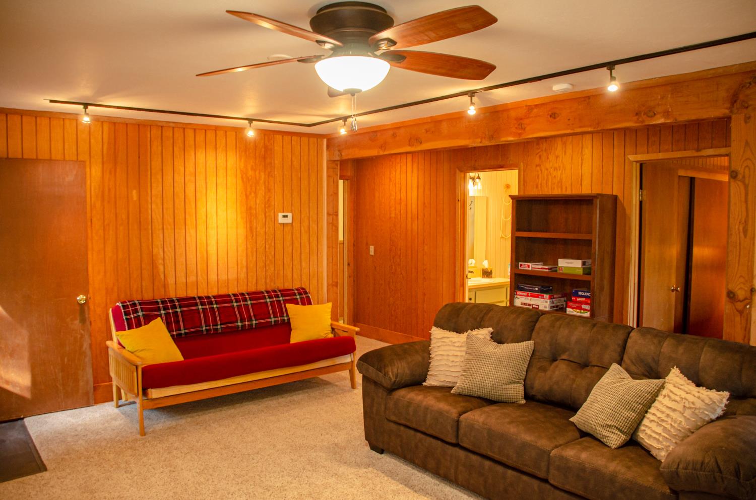 24033 Pine Cone Road Mi Wuk Village, CA 95346 - Photo 57 of 80 a living room with furniture and a wooden floor