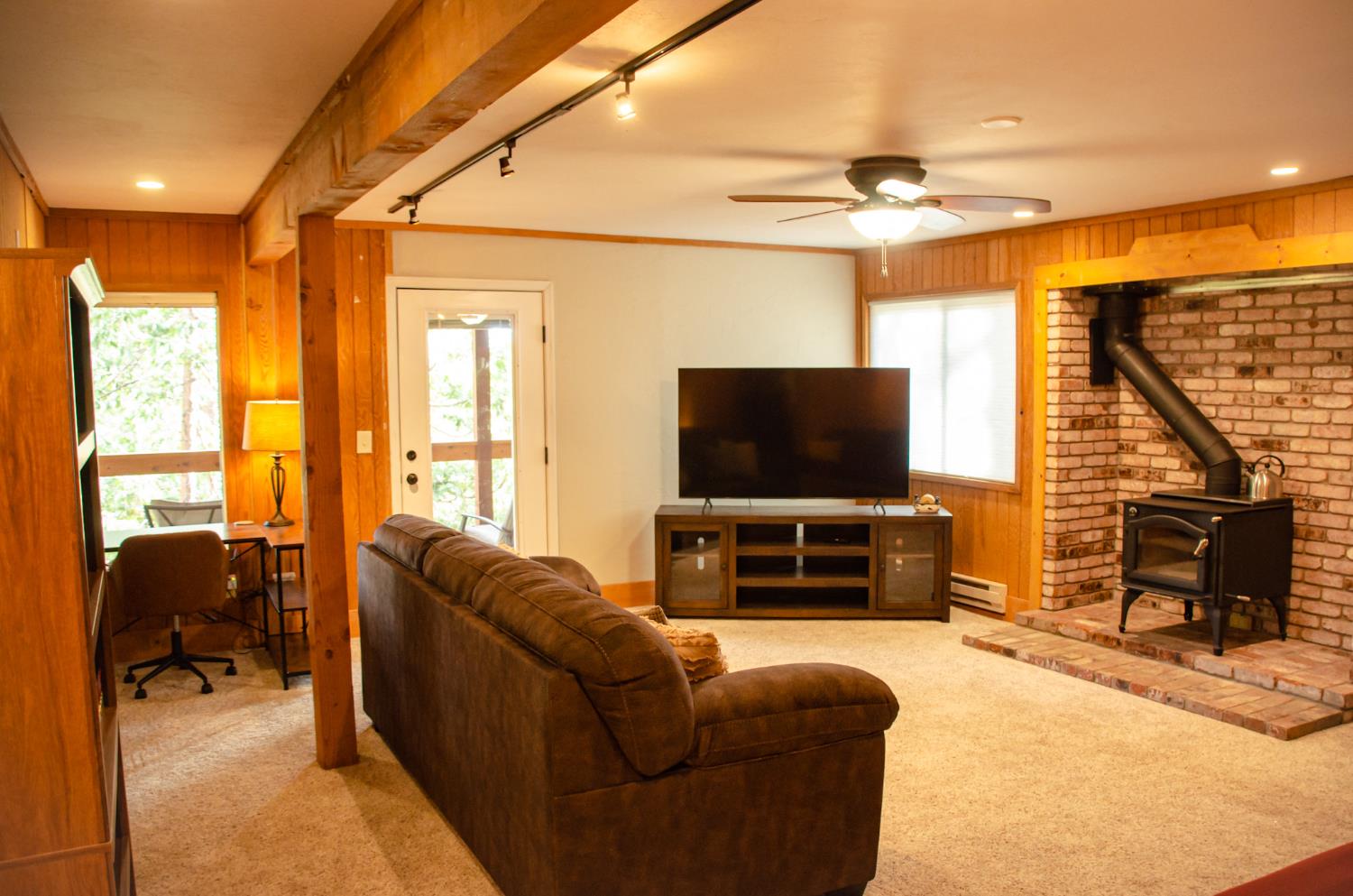 24033 Pine Cone Road Mi Wuk Village, CA 95346 - Photo 59 of 80 a living room with furniture and a flat screen tv