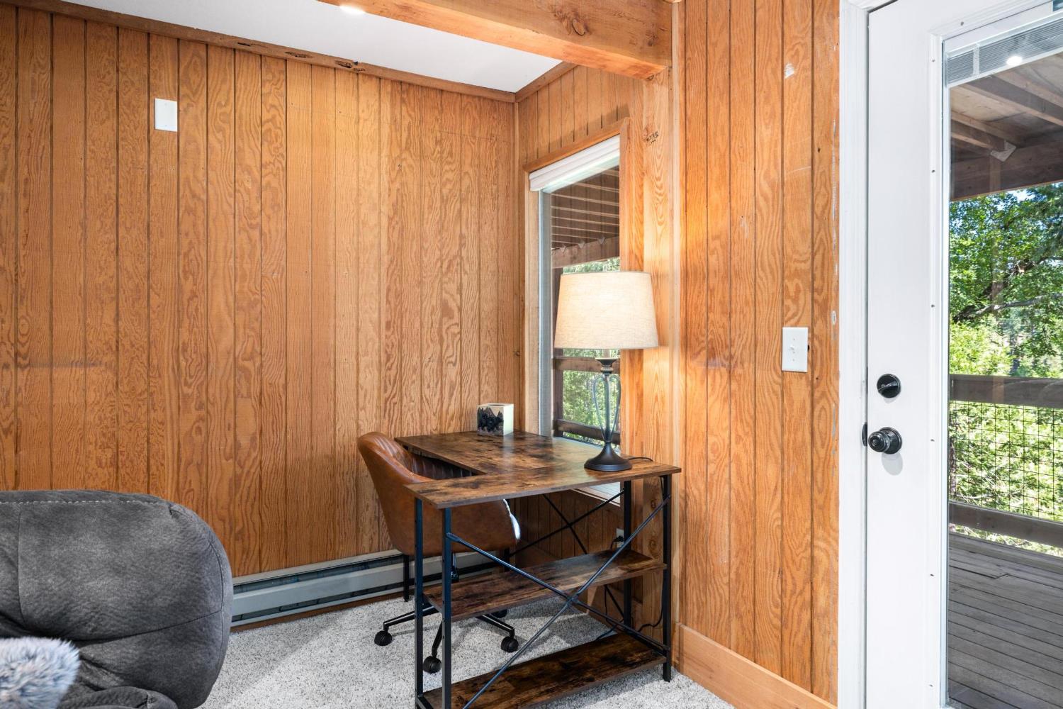 24033 Pine Cone Road Mi Wuk Village, CA 95346 - Photo 60 of 80 a view of a workspace with furniture and a window