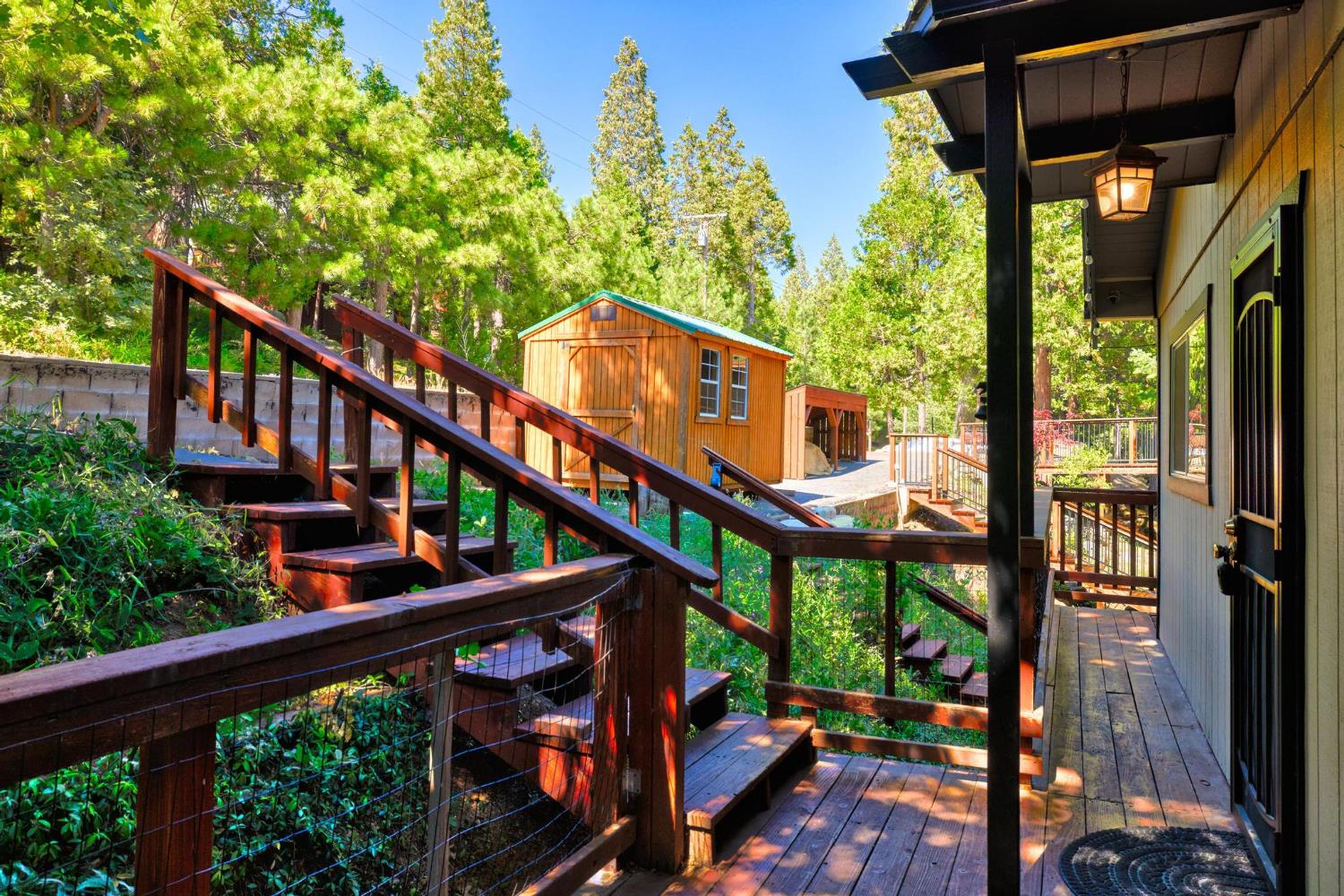24033 Pine Cone Road Mi Wuk Village, CA 95346 - Photo 6 of 80 a view of a balcony with chairs