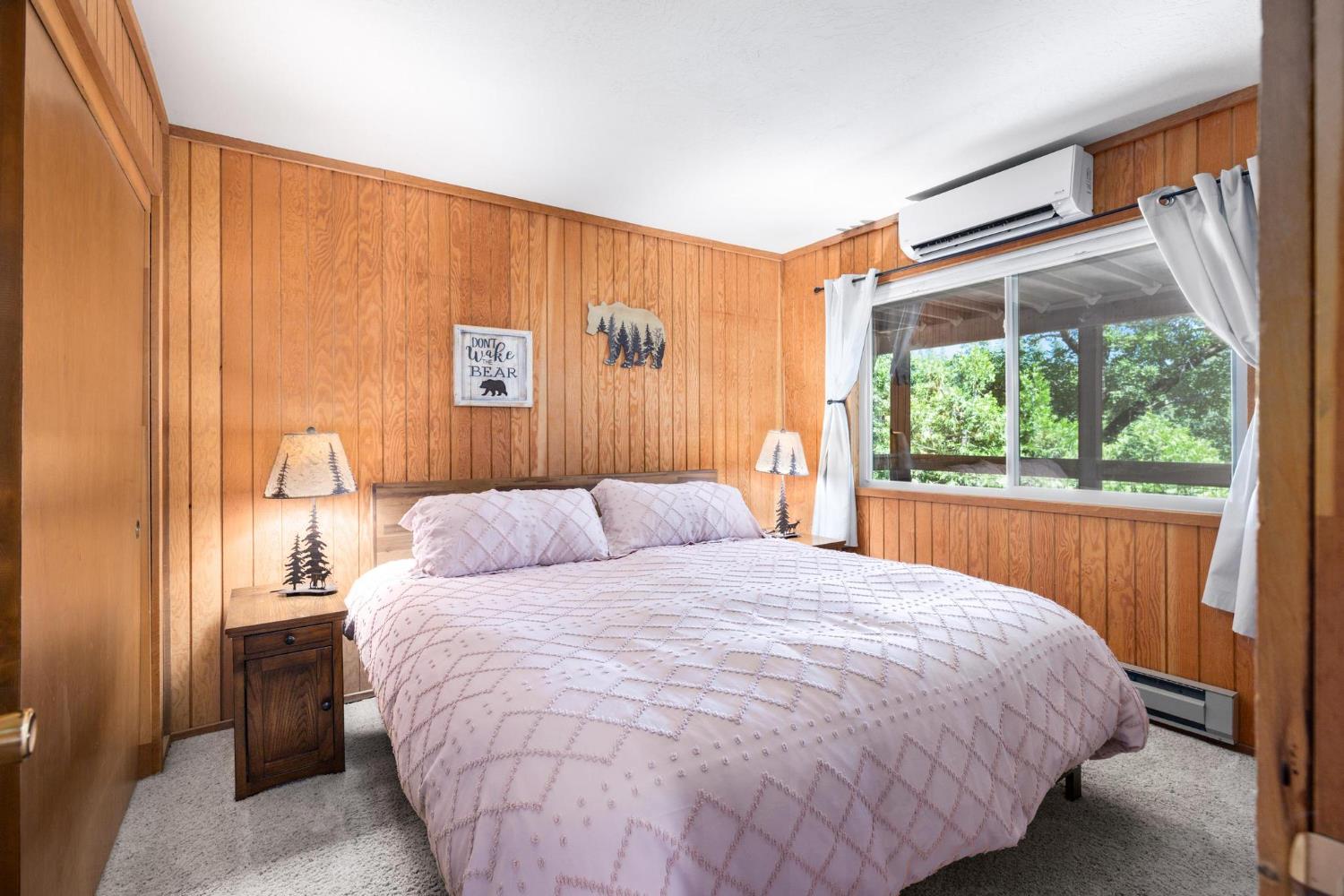 24033 Pine Cone Road Mi Wuk Village, CA 95346 - Photo 65 of 80 a bedroom with a bed and a window