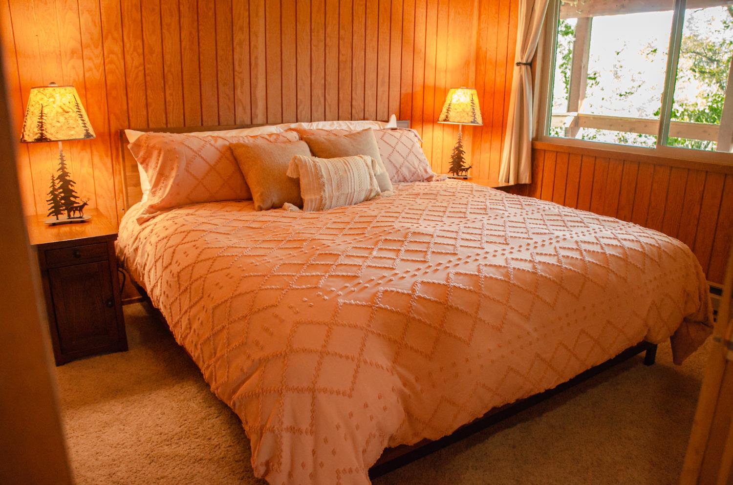 24033 Pine Cone Road Mi Wuk Village, CA 95346 - Photo 67 of 80 a bed sitting in a bedroom next to a window