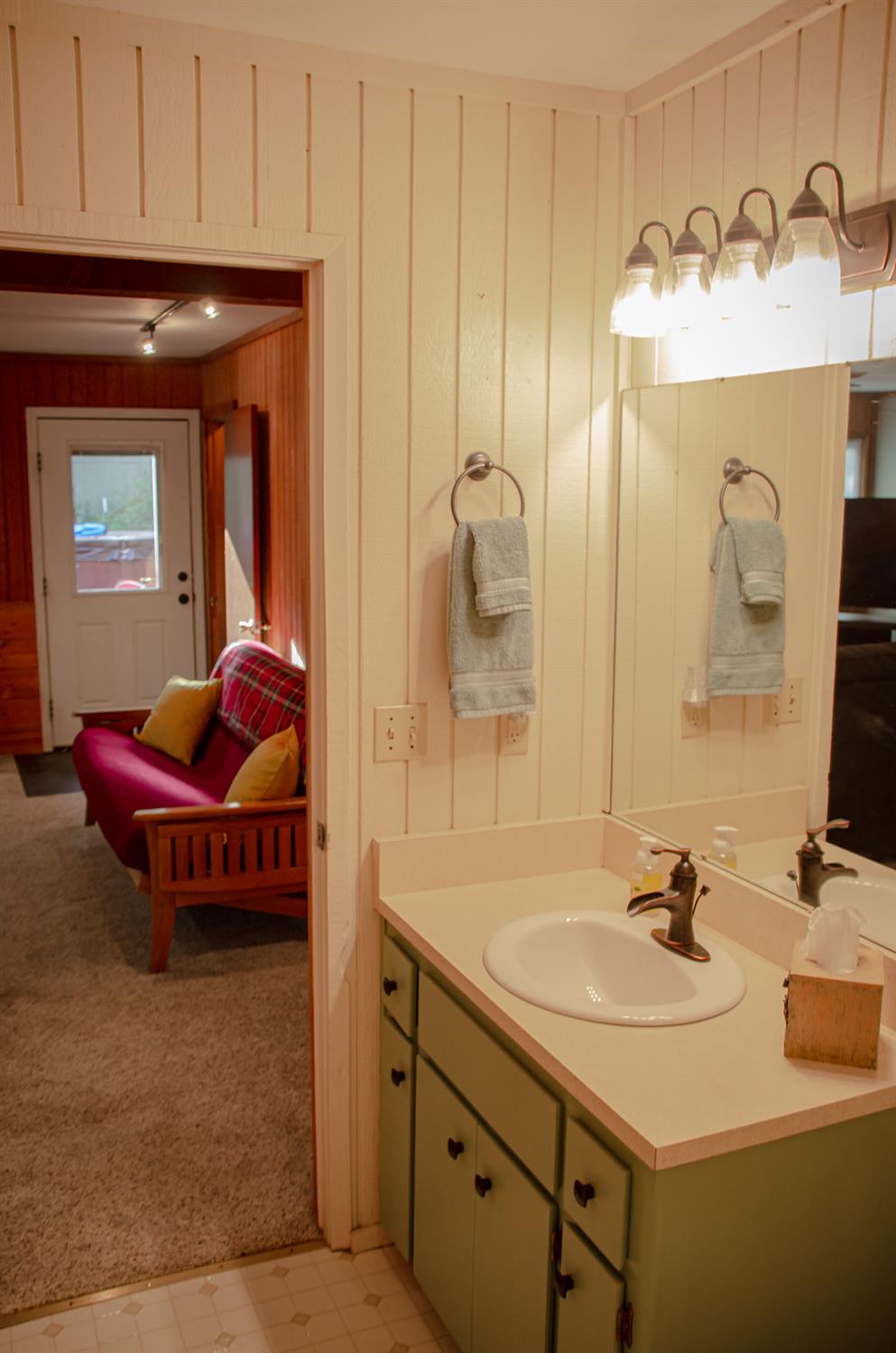 24033 Pine Cone Road Mi Wuk Village, CA 95346 - Photo 70 of 80 a en suite bathroom with a sink and a mirror