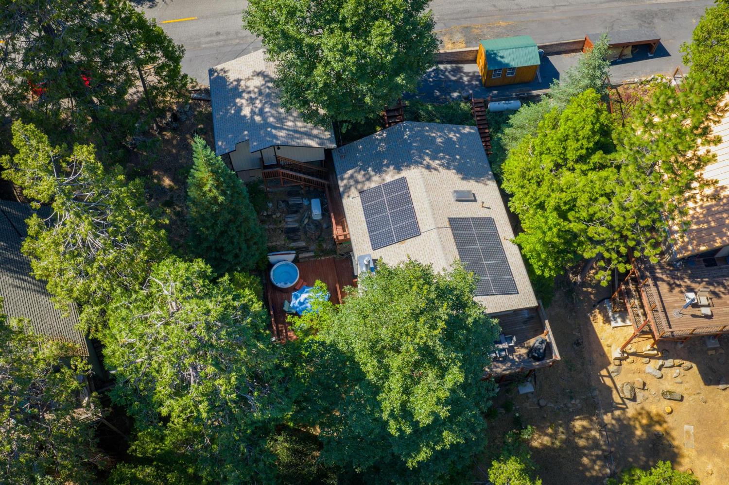 24033 Pine Cone Road Mi Wuk Village, CA 95346 - Photo 9 of 80 an aerial view of a house with a yard and garden