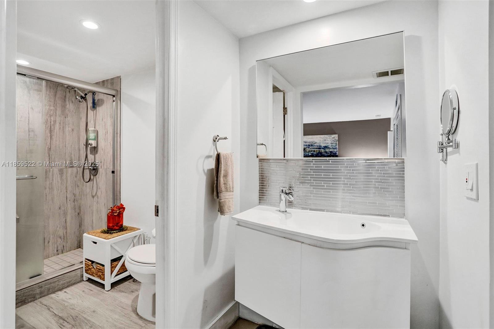 8401 Southwest 107th Avenue, Unit 111E Miami, FL 33173 - Photo 15 of 31 a bathroom with a tub sink mirror and shower