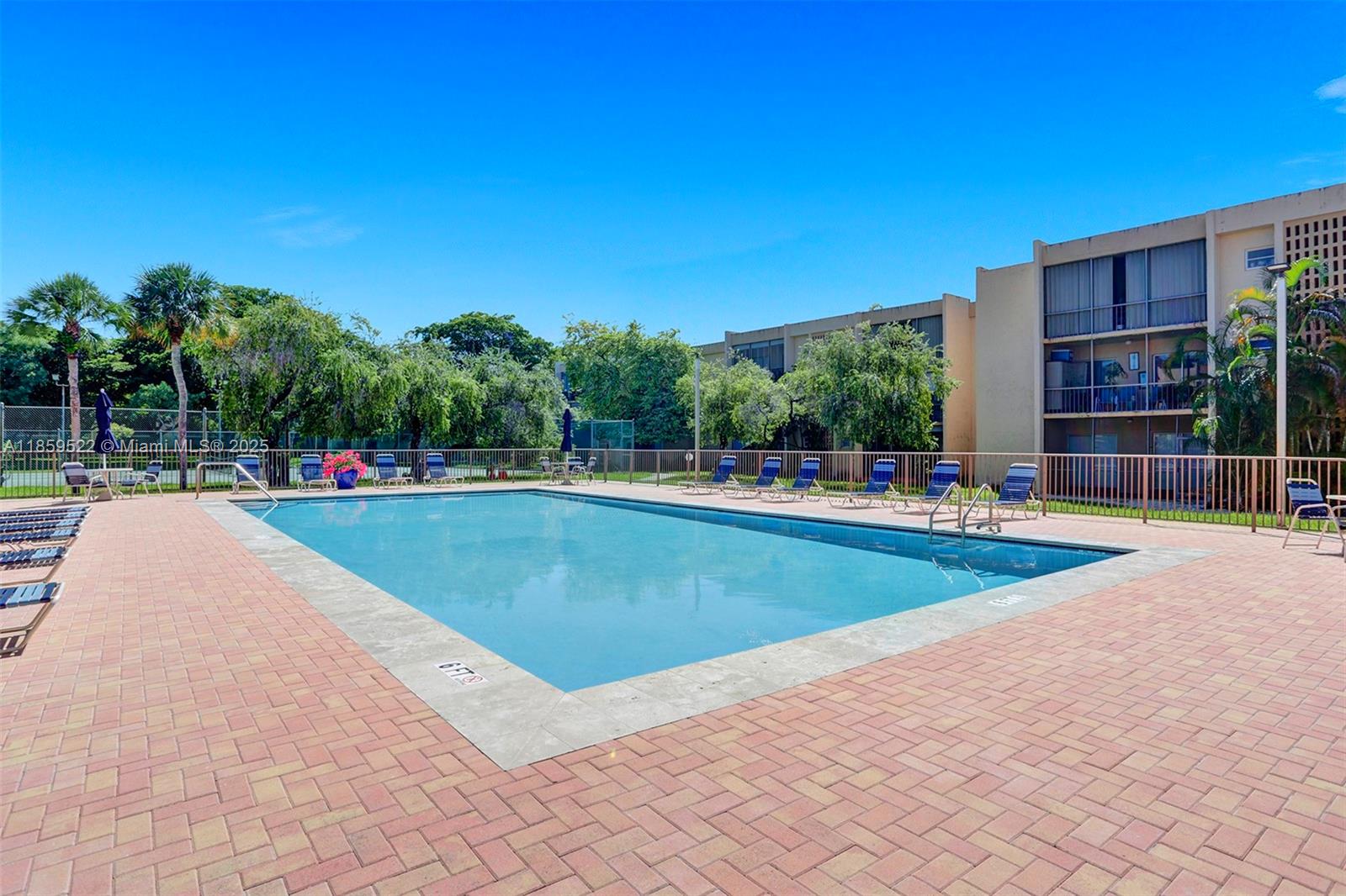 8401 Southwest 107th Avenue, Unit 111E Miami, FL 33173 - Photo 30 of 31 a view of swimming pool with a yard and sitting area