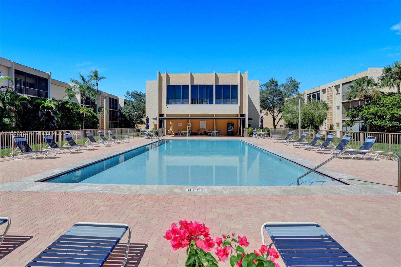 8401 Southwest 107th Avenue, Unit 111E Miami, FL 33173 - Photo 31 of 31 a view of a swimming pool with a patio