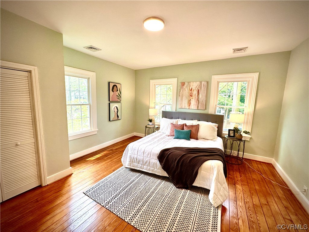 302 Main Street West Point, VA 23181 - Photo 13 of 24 a bedroom with a bed and wooden floor