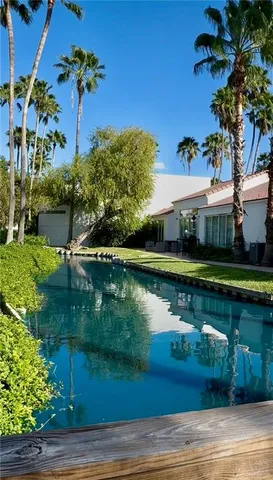 a view of a lake with a house in the background