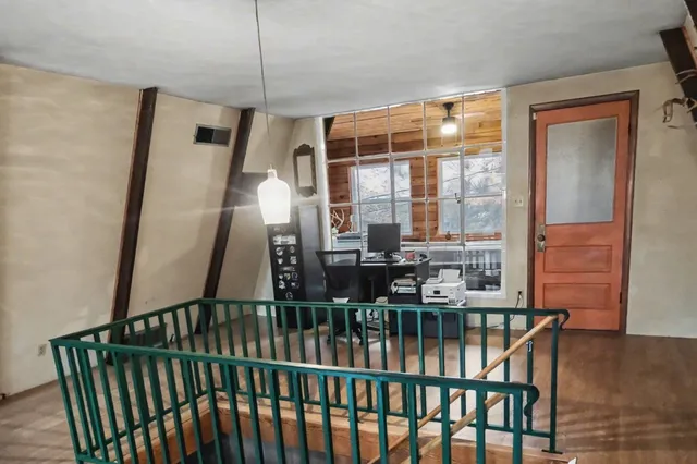 a view of a balcony with furniture