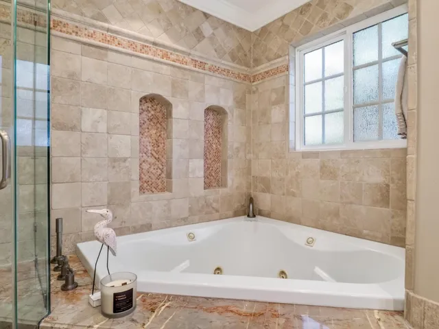 a bedroom with a large bed and a closet