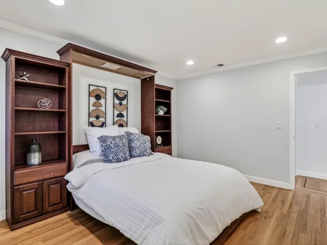 a kitchen with a sink a counter top space and cabinets