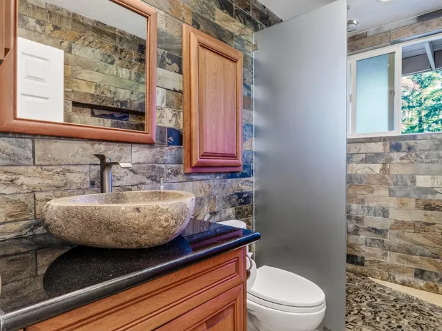 an aerial view of a house with yard swimming pool and outdoor seating