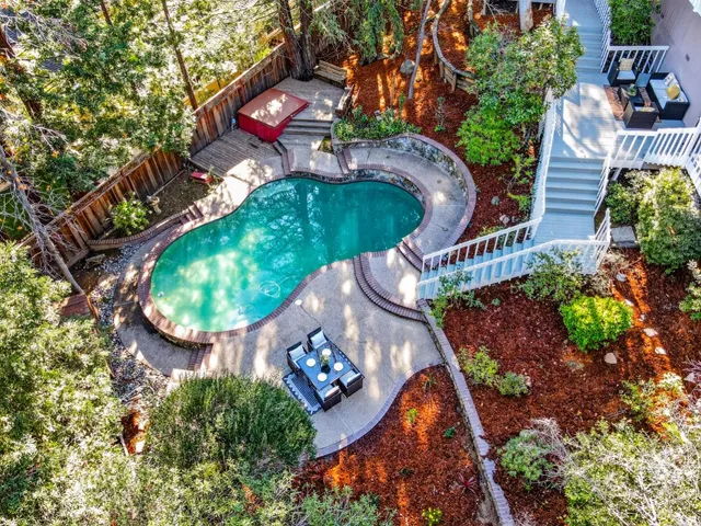 a view of a chairs and table in the patio