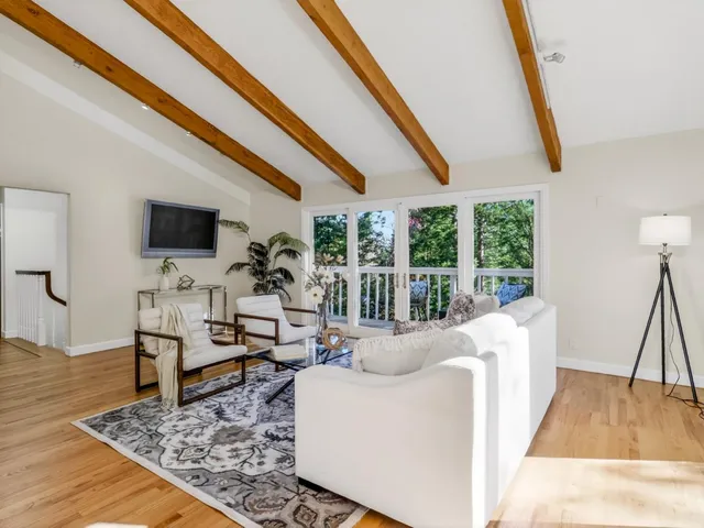a view of a dining room with furniture window and outside view